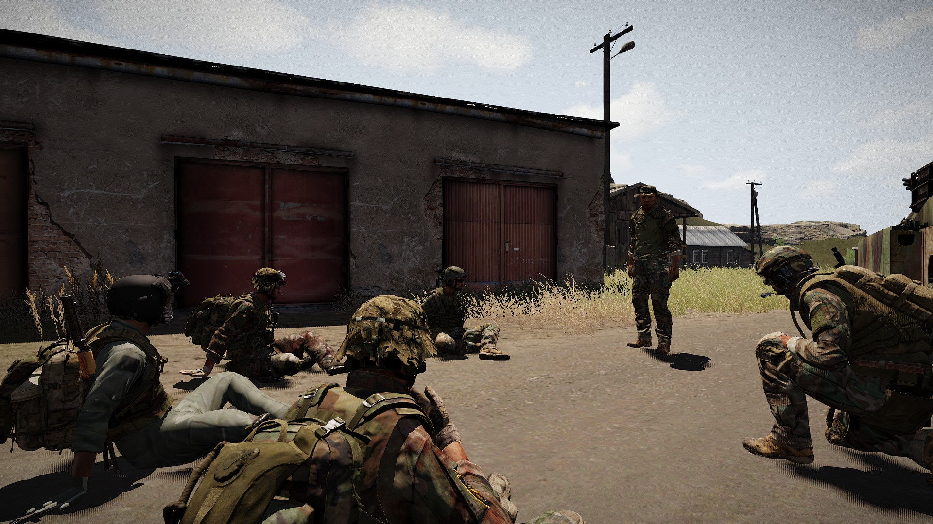 Kodiak infantry sitting together for an Arma 3 briefing while a leader addresses the squad.